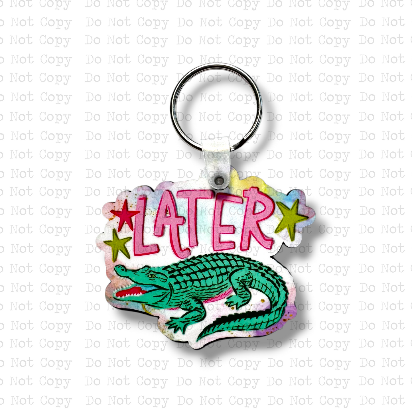 Custom-shaped contoured MDF wood sublimation keychain blank kit featuring a detailed green cartoon alligator and text that says LATER with lime green stars, shown with keyring hardware.