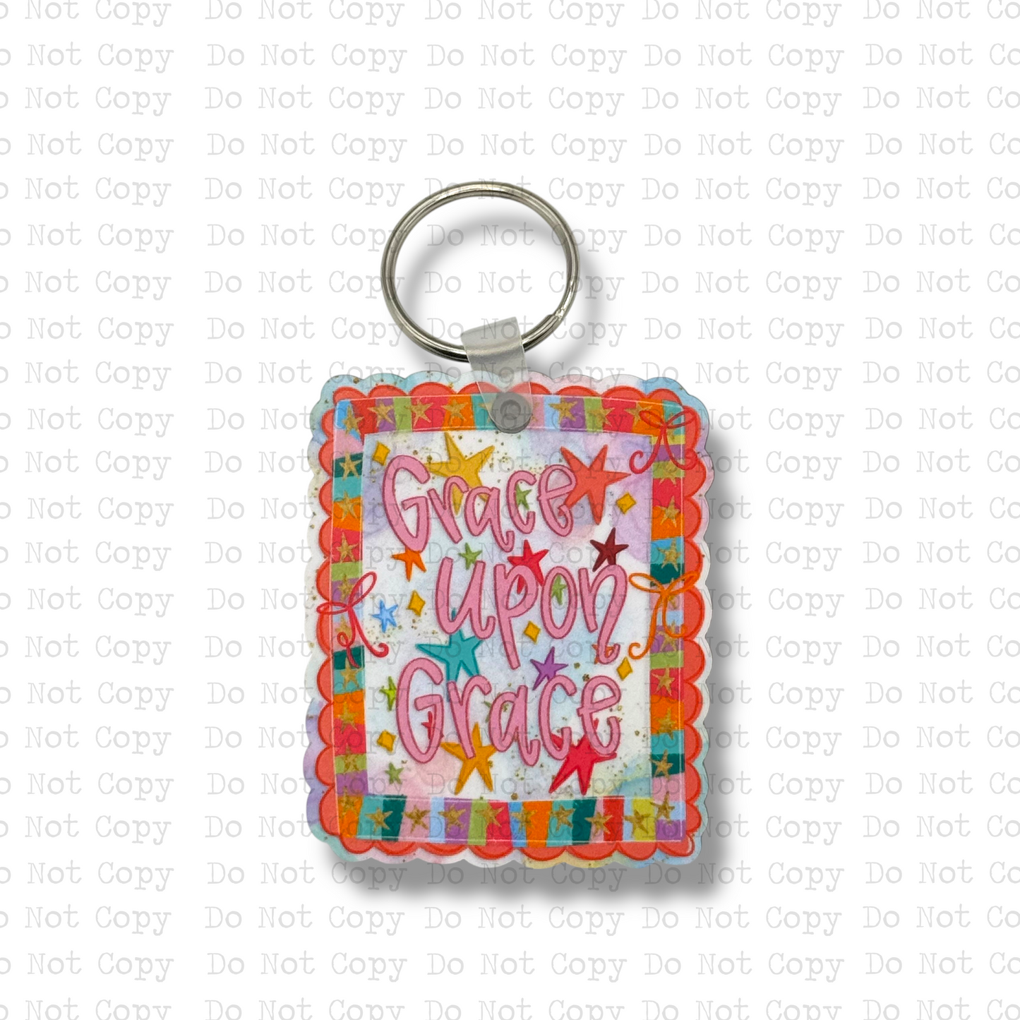 Custom-shaped contoured scalloped square MDF wood sublimation keychain blank kit featuring a colorful retro star Christian design with the text Grace upon Grace in pink script, shown with keyring hardware.