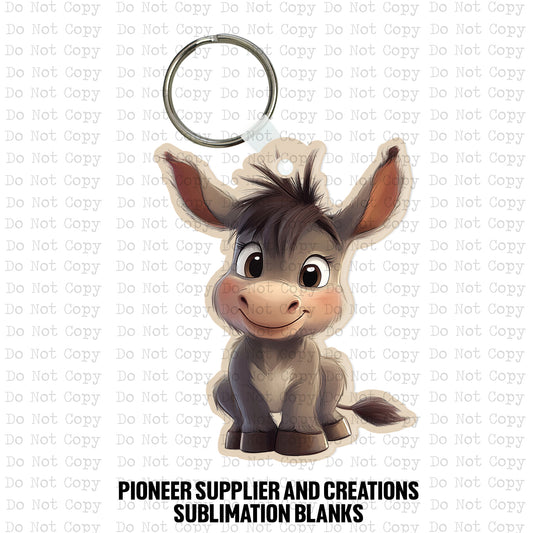 Custom-shaped contoured MDF wood sublimation keychain blank kit featuring a cute smiling cartoon baby donkey with big eyes, shown with keyring hardware.