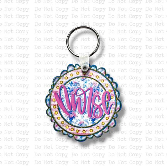 Custom-shaped contoured scalloped round MDF wood sublimation keychain blank kit featuring a floral circle design with the text Nurse in hot pink script, shown with keyring hardware.