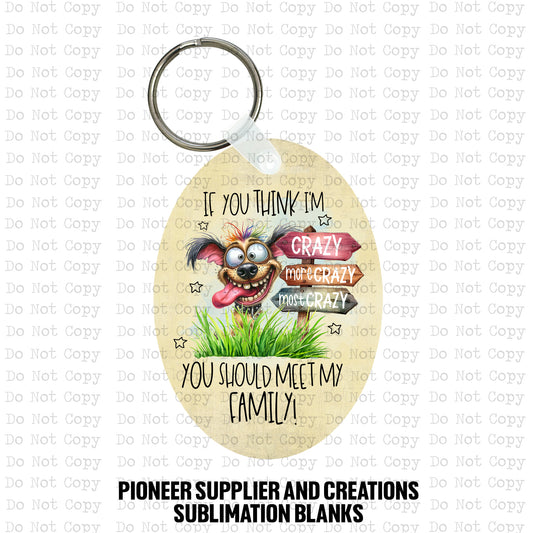 Round MDF wood sublimation keychain blank kit featuring a funny wide-eyed cartoon dog and text that says If you think I'm crazy you should meet my family, shown with keyring hardware.