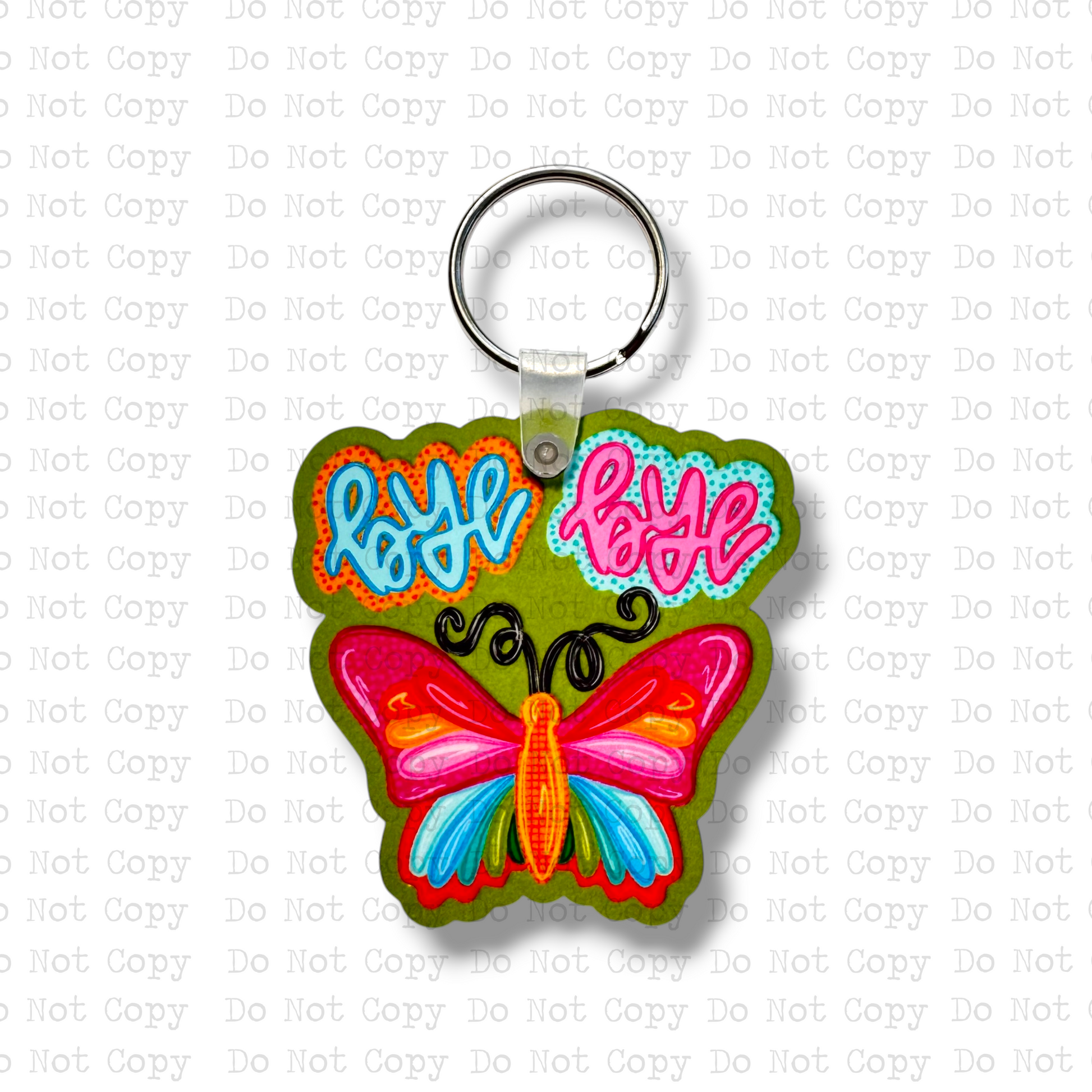 Custom-shaped contoured MDF wood sublimation keychain blank kit featuring a colorful retro doodle style butterfly with text that says bye bye, shown with keyring hardware.